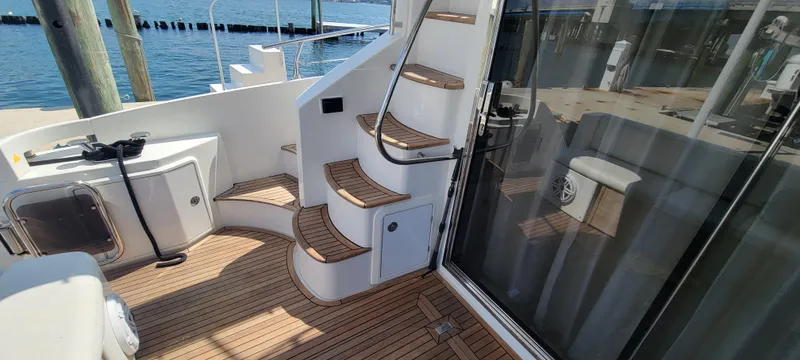  Yacht Photos Pics 2013 Azimut 45 Flybridge yacht with teak deck and spiral staircase.