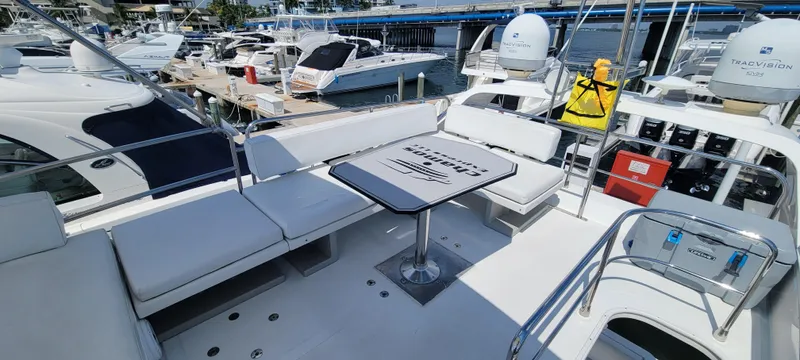  Yacht Photos Pics 2013 Azimut 45 Flybridge yacht with spacious seating and table on the deck.