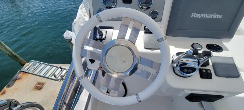  Yacht Photos Pics Steering wheel and controls of a 2013 Azimut 45 Flybridge yacht.