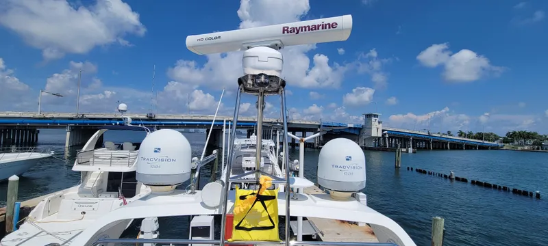  Yacht Photos Pics Azimut 45 Flybridge 2013 yacht docked near a bridge on a sunny day.