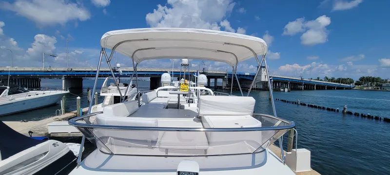  Yacht Photos Pics 2013 Azimut 45 Flybridge yacht docked at marina under clear blue sky.