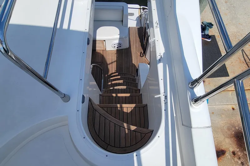  Yacht Photos Pics Staircase on 2013 Azimut 45 Flybridge yacht with wooden steps and stainless steel railings.