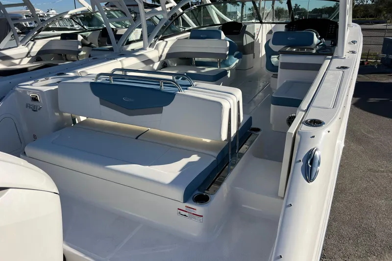  Yacht Photos Pics 2026 Robalo R317 Dual Console boat interior with white and blue seating.