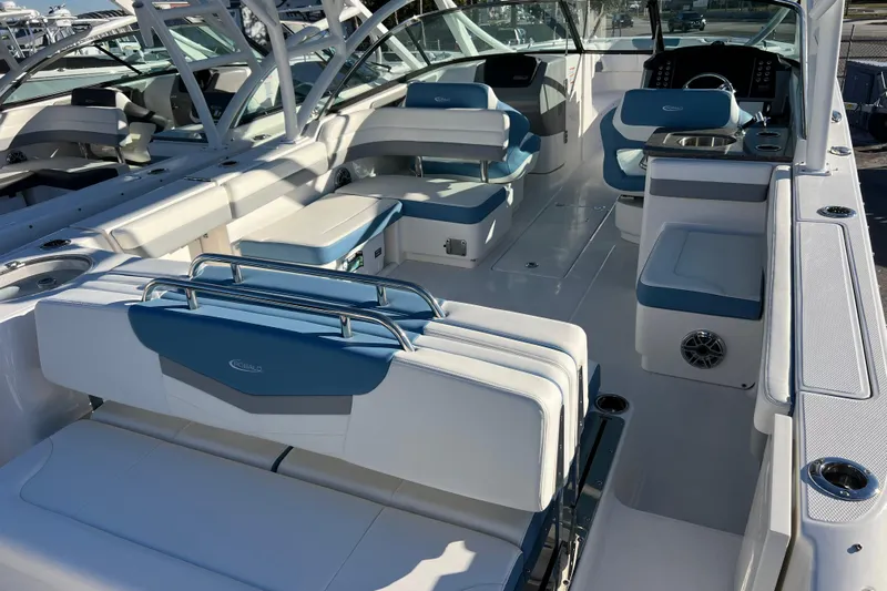 Yacht Photos Pics 2026 Robalo R317 Dual Console boat interior with blue and white seating.