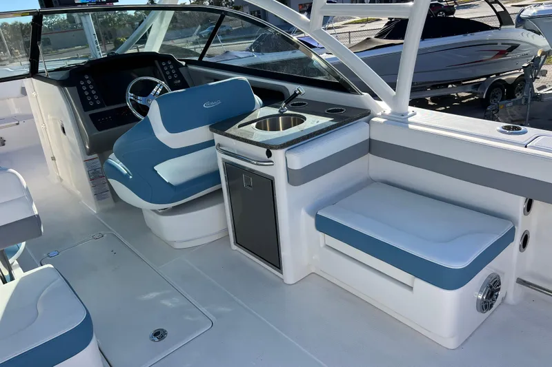  Yacht Photos Pics 2026 Robalo R317 Dual Console interior with helm, seating, and sink.