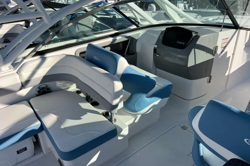  Yacht Photos Pics 2026 Robalo R317 Dual Console interior with blue and white seating, modern dashboard.