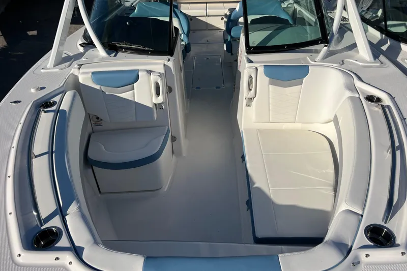  Yacht Photos Pics 2026 Robalo R317 Dual Console boat interior with white seating and modern design.