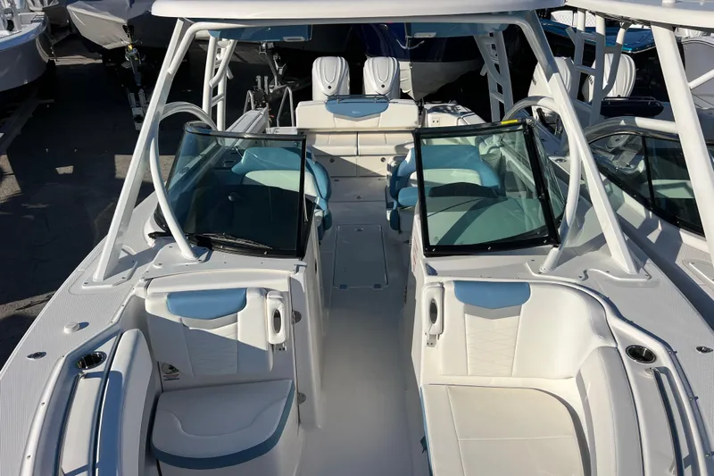  Yacht Photos Pics 2026 Robalo R317 Dual Console boat interior with white seating and windshield.