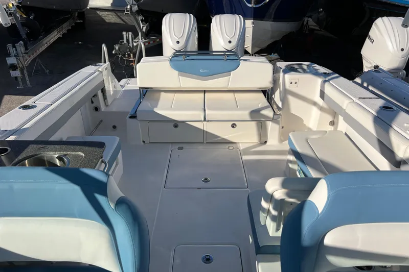  Yacht Photos Pics 2026 Robalo R317 Dual Console boat interior with seating and amenities.