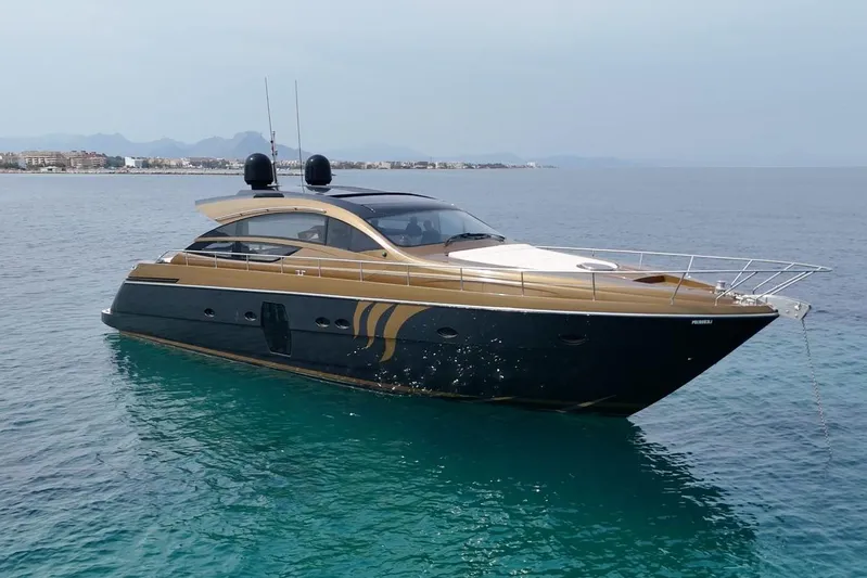 Candyman Yacht Photos Pics Luxurious 2009 Pershing 64 yacht cruising on clear blue waters.
