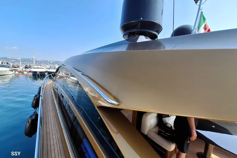 Candyman Yacht Photos Pics 2009 Pershing 64 yacht docked in a marina, showcasing sleek design and luxury features.