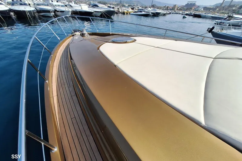 Candyman Yacht Photos Pics 2009 Pershing 64 yacht deck with sleek design, docked in a marina.