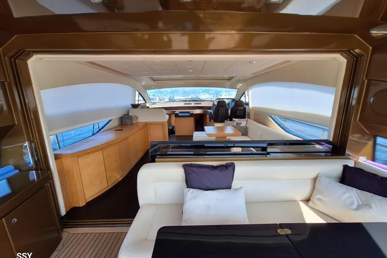 Candyman Yacht Photos Pics Luxurious interior of a 2009 Pershing 64 yacht, featuring elegant seating and modern design.