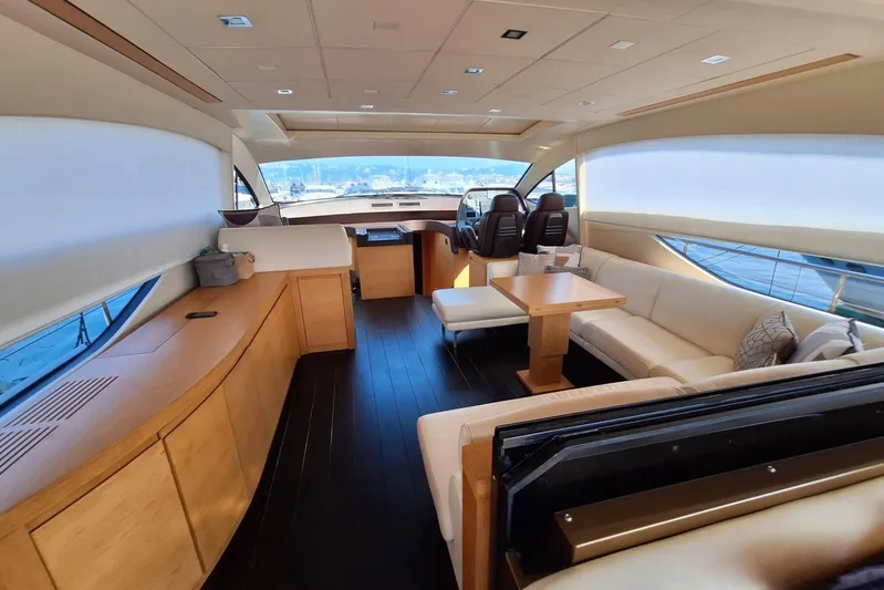 Candyman Yacht Photos Pics Luxurious interior of a 2009 Pershing 64 yacht with elegant seating and modern design.