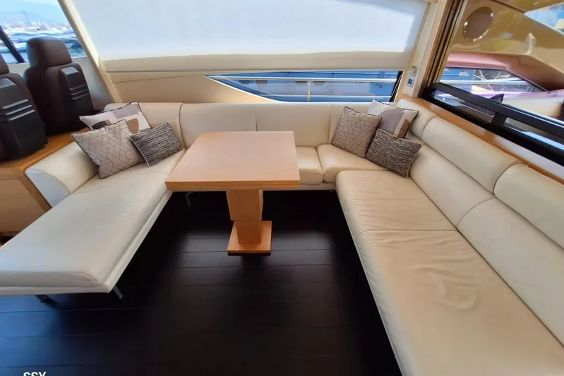 Candyman Yacht Photos Pics Luxurious interior of 2009 Pershing 64 yacht with elegant seating and table.