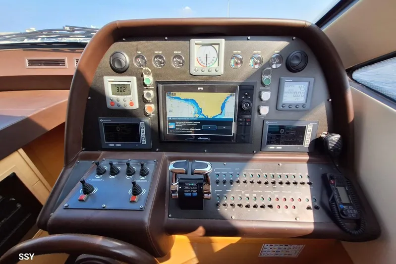 Candyman Yacht Photos Pics Cockpit of 2009 Pershing 64 yacht with navigation and control panels.