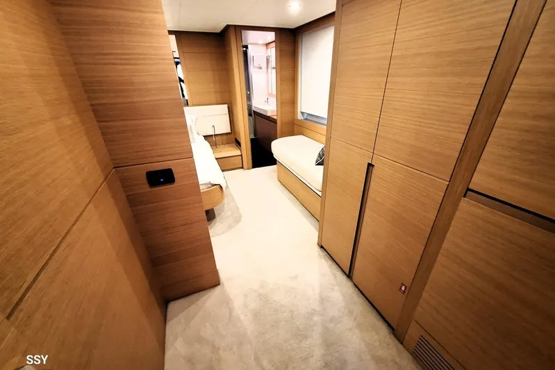 Candyman Yacht Photos Pics Luxurious interior of 2009 Pershing 64 yacht with modern wood paneling and elegant furnishings.