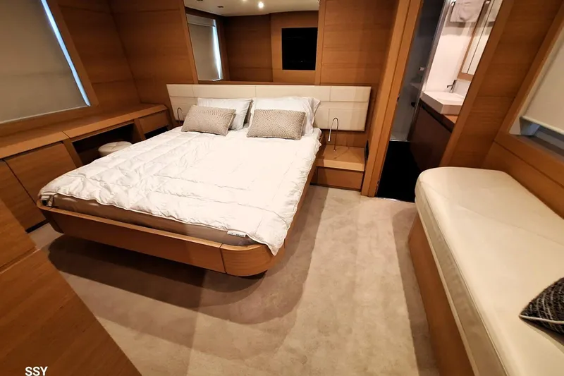 Candyman Yacht Photos Pics Luxurious bedroom interior of 2009 Pershing 64 yacht with modern furnishings.