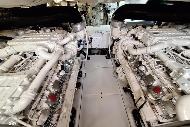 Candyman Yacht Photos Pics Engine room of a 2009 Pershing 64 yacht, showcasing dual powerful engines.