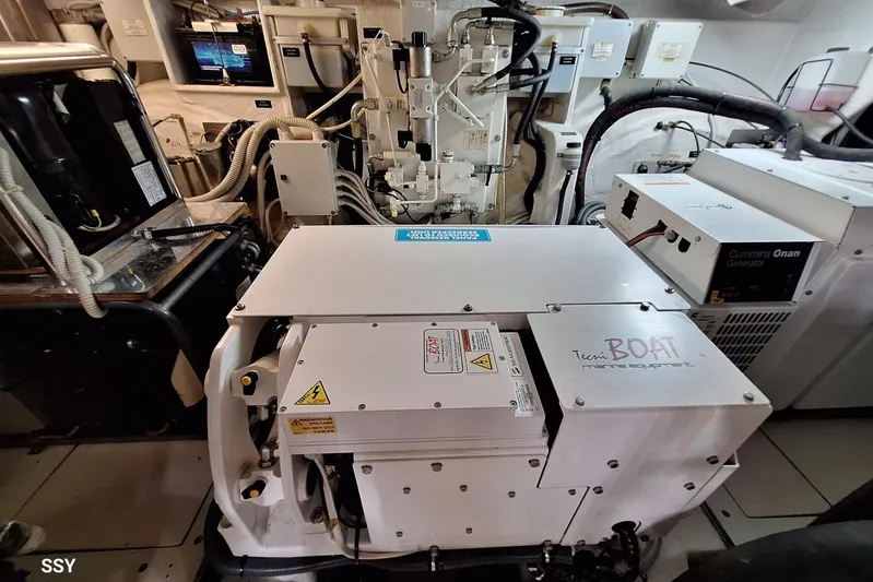 Candyman Yacht Photos Pics Engine room of a 2009 Pershing 64 yacht with Cummins Onan generator.