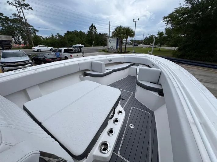 Yacht Photos Pics 2022 Fountain 38 CC boat interior with white seating and gray flooring.
