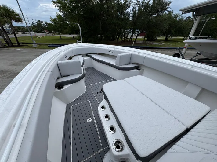  Yacht Photos Pics 2022 Fountain 38 CC boat interior with sleek seating and modern design.
