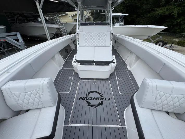  Yacht Photos Pics 2022 Fountain 38 CC boat interior with sleek seating and modern design.