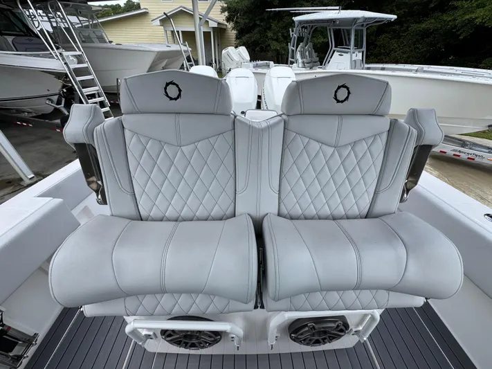  Yacht Photos Pics Luxury seating on a 2022 Fountain 38 CC boat, featuring diamond-stitched upholstery.