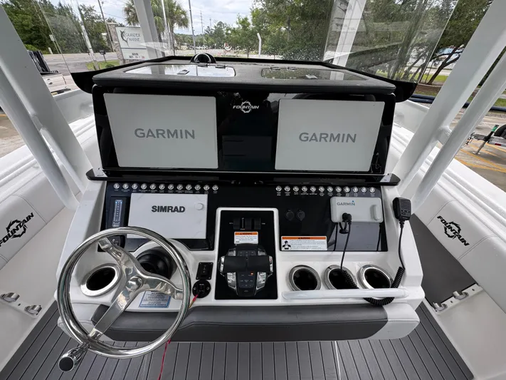  Yacht Photos Pics 2022 Fountain 38 CC boat dashboard with Garmin and Simrad navigation systems.