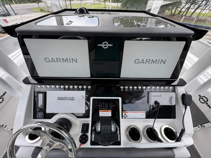  Yacht Photos Pics Control panel of 2022 Fountain 38 CC boat with Garmin and Simrad displays.