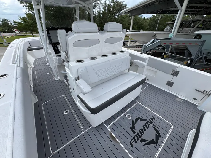  Yacht Photos Pics 2022 Fountain 38 CC boat interior with white seating and gray flooring.