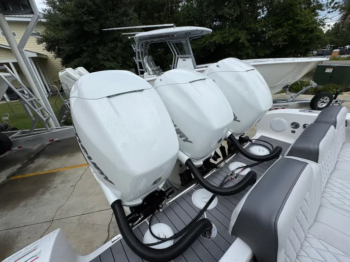  Yacht Photos Pics 2022 Fountain 38 CC boat with triple Mercury outboard engines.