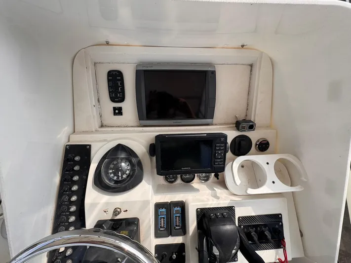  Yacht Photos Pics Control panel of a 1998 Contender 35 Express Side Console boat with navigation instruments.