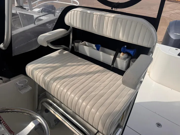  Yacht Photos Pics Contender 35 Express Side Console 1998 boat seat with storage and armrests.
