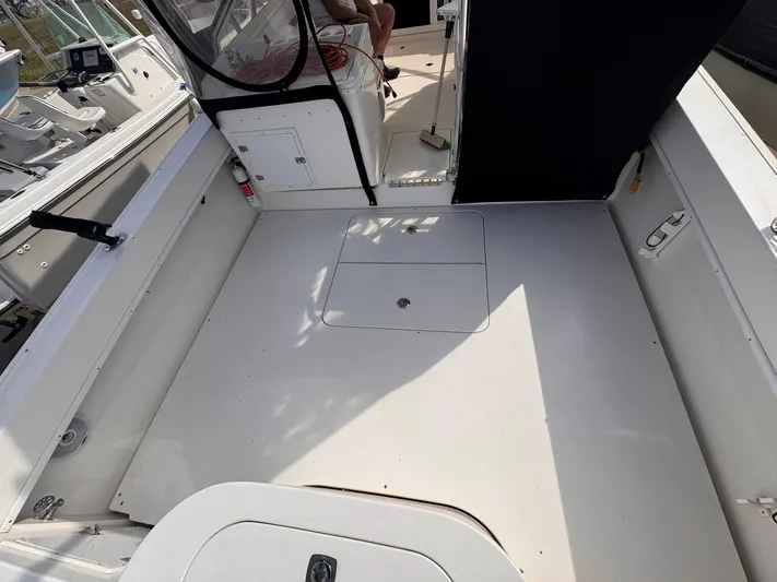  Yacht Photos Pics 1998 Contender 35 Express Side Console boat interior, featuring spacious deck and seating area.