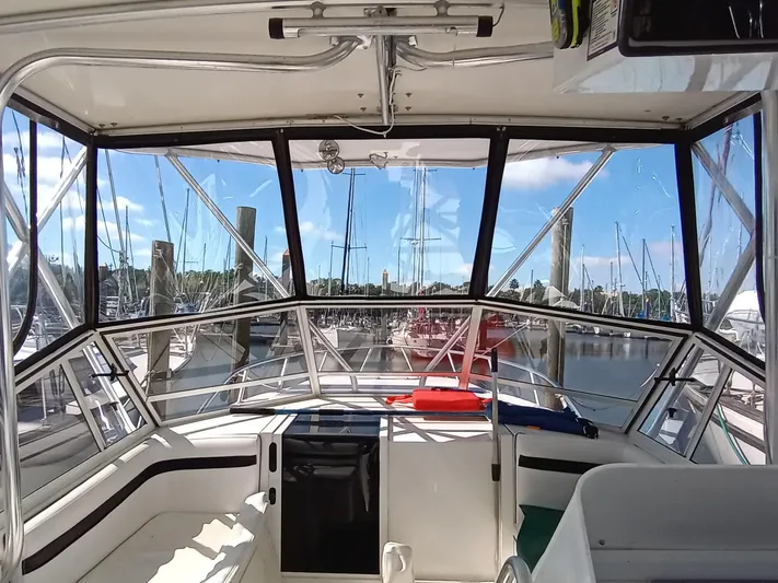  Yacht Photos Pics 1998 Contender 35 Express Side Console boat interior with marina view.