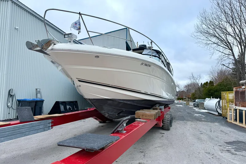  Yacht Photos Pics 2004 Searay 360 Sundancer boat on trailer near industrial building.