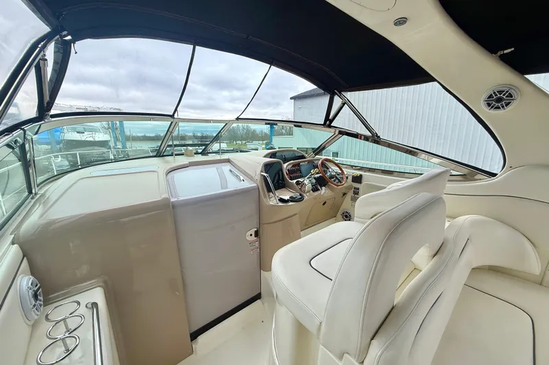  Yacht Photos Pics 2004 Searay 360 Sundancer cockpit with beige interior and modern controls.