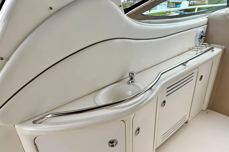  Yacht Photos Pics 2004 Searay 360 Sundancer boat interior with sink and storage cabinets.