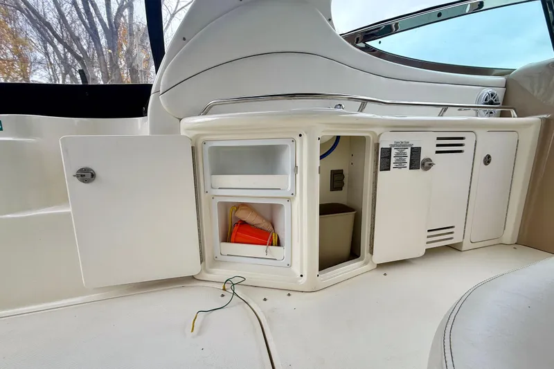  Yacht Photos Pics 2004 Searay 360 Sundancer boat interior with open storage compartments.