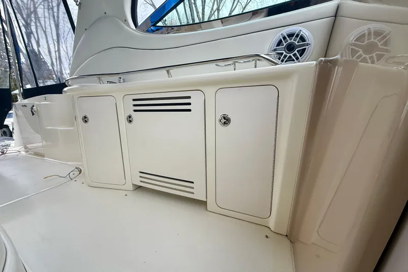  Yacht Photos Pics 2004 Searay 360 Sundancer boat interior with storage cabinets and speakers.