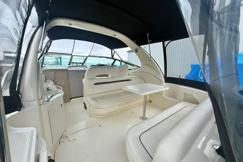  Yacht Photos Pics 2004 Searay 360 Sundancer interior with seating and table, featuring a sleek design.