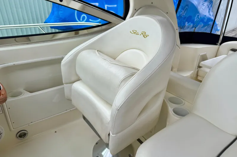  Yacht Photos Pics 2004 Searay 360 Sundancer interior with white leather seating and cup holders.