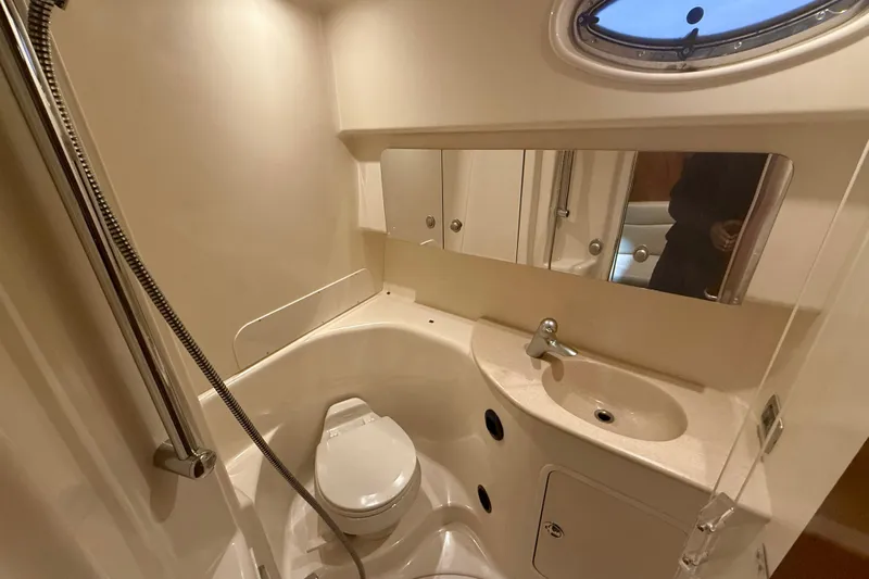  Yacht Photos Pics 2004 Searay 360 Sundancer bathroom with shower, sink, and toilet.