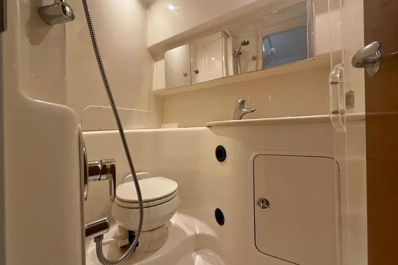  Yacht Photos Pics Bathroom interior of 2004 Searay 360 Sundancer yacht, featuring toilet and shower.