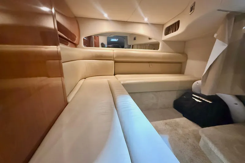  Yacht Photos Pics Interior cabin of 2004 Searay 360 Sundancer with beige seating and wood accents.
