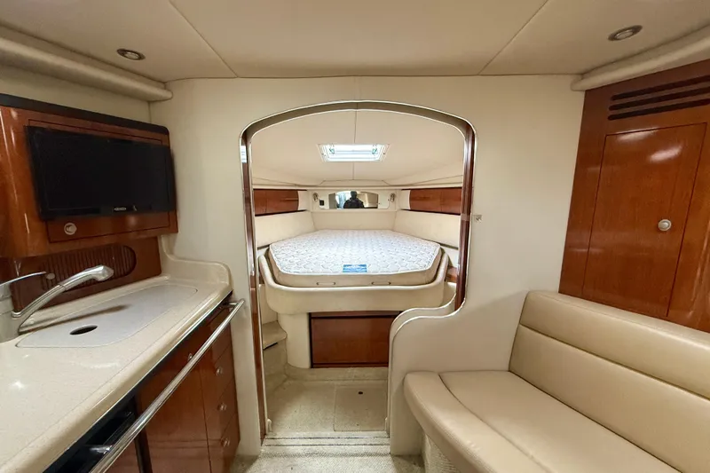  Yacht Photos Pics 2004 Searay 360 Sundancer interior with bed, kitchenette, and seating area.