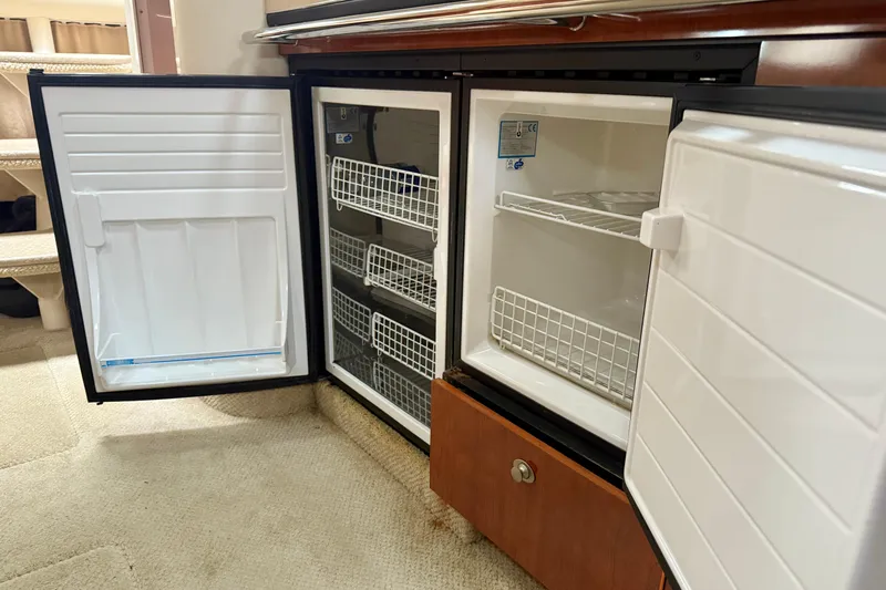  Yacht Photos Pics Open refrigerator and freezer on 2004 Searay 360 Sundancer yacht interior.
