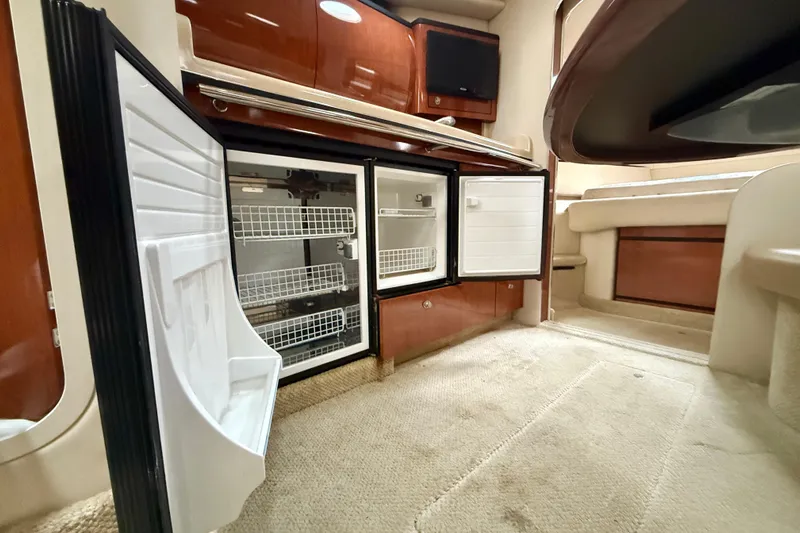  Yacht Photos Pics 2004 Searay 360 Sundancer interior with open fridge, showcasing spacious cabin design.
