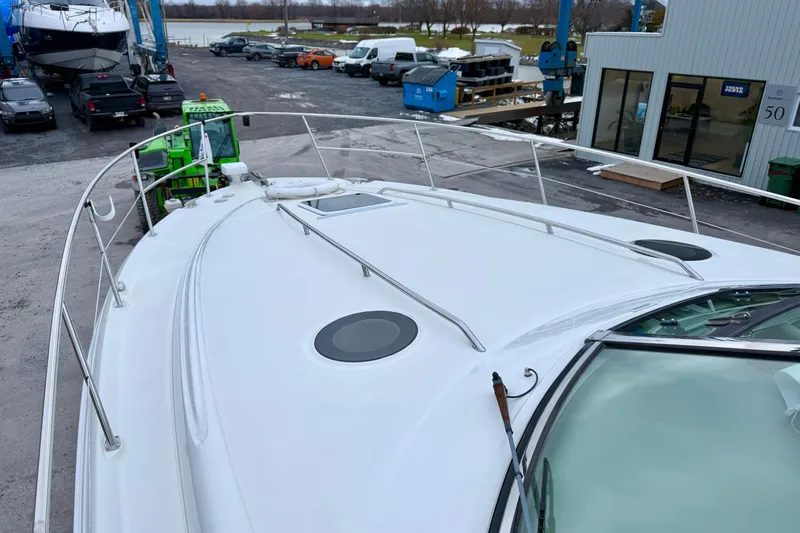  Yacht Photos Pics 2004 Searay 360 Sundancer yacht on dry dock, marina background.